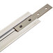 A white metal Cambro Camshelving® track rail joiner with screws.