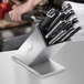 An Edlund stainless steel knife block holding knives.