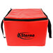 A red Sterno insulated food carrier with black handles.