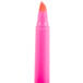 A pink highlighter pen with a white cap.