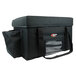 A black Sterno Delivery Deluxe insulated food carrier bag with a zipper and a handle.