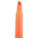 A close-up of a Bic Brite Liner Fluorescent Orange Chisel Tip Highlighter.