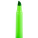 A green cylinder with a white lid and a green Bic Brite Liner pen with a chisel tip.