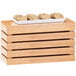 A Cal-Mil bamboo rectangle crate riser with cookies on a wooden tray.