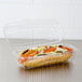 A sandwich in a Dart clear plastic hoagie container with a hinged lid.