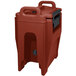 A red plastic Cambro Ultra Camtainer with a black handle and lid.