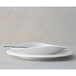 A white Villeroy & Boch porcelain oval plate with a spoon on it.