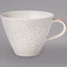 A white Terra Porcelain coffee cup with a crack pattern.