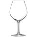 A clear Chef & Sommelier wine glass with a stem.