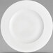 A close-up of a Villeroy & Boch white bone porcelain flat plate with a round rim.