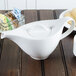 A white Villeroy & Boch porcelain teapot on a table.