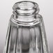 A clear glass Tablecraft salt and pepper shaker with a chrome plated lid.