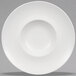 A close-up of a Villeroy & Boch white bone porcelain deep plate with a rim and circular center.