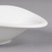 A close-up of a Villeroy & Boch white porcelain flat bowl with a small hole in the middle.