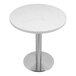 A white Art Marble Furniture Carrera White Quartz table top on a silver table base.