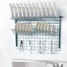 A Metro SmartWall G3 dish rack with plates and utensils on it.