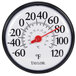 A round white and black Taylor wall thermometer with a red needle.