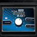 The electronic touchpad control panel with white variable speed control knob on a blue surface of a Waring TBB175 Torq 2.0 Blender.