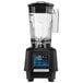 A black Waring TBB160 blender with a clear container.