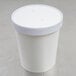 A white Choice paper soup container with a vented lid.