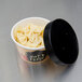 A Choice double poly-coated paper bowl of pasta with a black vented lid.