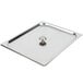 A stainless steel Vollrath flat cover with a metal knob on a metal tray.