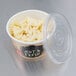 A Choice white double poly-coated paper container with pasta and a vented plastic lid.