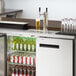 An Avantco stainless steel kegerator with a 2 tap tower.
