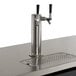 An Avantco stainless steel beer tap on a counter.