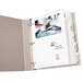A file folder with Avery Print-On white dividers inside.