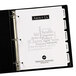 A black binder with Avery white print-on dividers.
