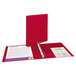 A red Avery binder with a white page.