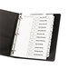 A black binder with white Avery Ready Index divider tabs.