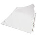 A white sheet of paper with three white file folder tabs with holes.