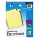 A package of blue Avery folder dividers with yellow paper and black text on white leather style tabs.