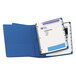 A blue binder with Avery white print-on dividers with a metal ring.