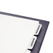 A white file folder with Avery 5-tab dividers and a label on it.
