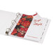 A binder with Avery Index Maker extra wide dividers and a clear label strip with a flower print.
