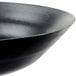 A close-up of a black Town carbon steel fry pan.