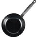 A black Town carbon steel fry pan with a handle.