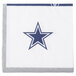 A white Creative Converting beverage napkin with a blue star on it.