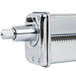 A close-up of the stainless steel pasta roller attachment for a KitchenAid mixer.