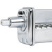 A stainless steel KitchenAid pasta roller cylinder with a hexagon-shaped head.