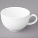 A close-up of a Villeroy & Boch white porcelain coffee cup with a handle.