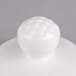 A white round porcelain lid with a ball on top.