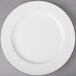 A Villeroy & Boch white porcelain flat plate on a gray surface.