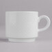 A white Villeroy & Boch porcelain coffee cup with a handle on a gray surface.
