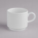 A close up of a Villeroy & Boch white porcelain coffee cup with a handle.