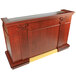 A Bon Chef portable wood liquor bar with a sink and gold trim.