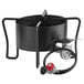 A black metal Backyard Pro outdoor range with hoses and a red valve.